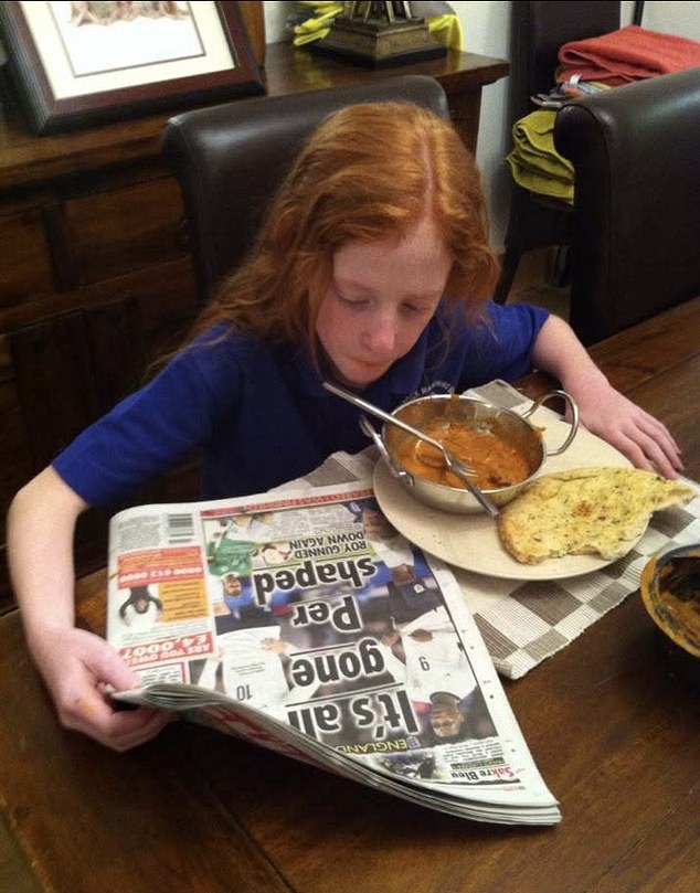 Sophie, aged ten, catches up with the news while eating her favourite curry and naan bread