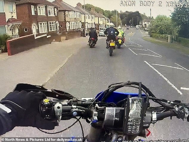 Police are seen chasing balaclava-clad youths through Darlington, Co Durham