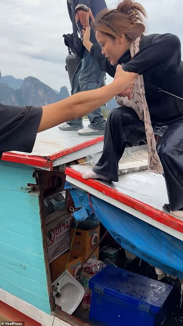 Frightened passengers were recorded being pulled to safety from the Mekong River