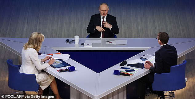 In this pool photograph distributed by the Russian state agency Sputnik, Russia's President Vladimir Putin holds his annual end-of-year press conference in Moscow on December 19, 2025. (Photo by Vyacheslav PROKOFYEV / POOL / AFP via Getty Images)