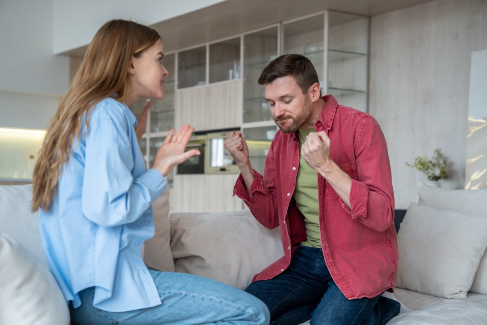 Angry abusive husband and hysterical wife quarrelling at home, shouting loudly, blaming each other