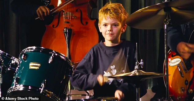 In the film, Thomas Brodie-Sangster played Liam Neeson's step-son Sam and his main character arc followed him learning the drums in a bid to impress his classmate Joanna