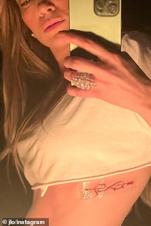 The singer who opted for an infinity sign with an arrow on it that read the words 'Jennifer' and 'Ben'