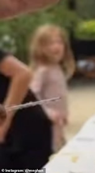 Princess Lilibet could be seen in the back of a video shared by Meghan of Harry carving a pumpkin