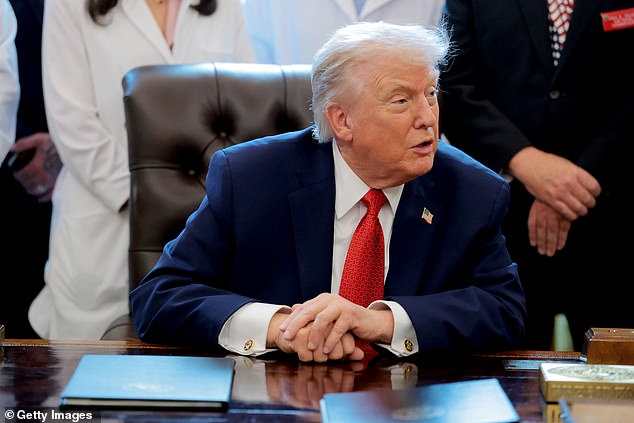 WASHINGTON, DC - DECEMBER 18: U.S. President Donald Trump speaks to journalists after signing an executive order in the Oval Office of the White House on December 18, 2025 in Washington, DC. Trump signed the order reclassifying marijuana as a schedule III drug. (Photo by Anna Moneymaker/Getty Images)