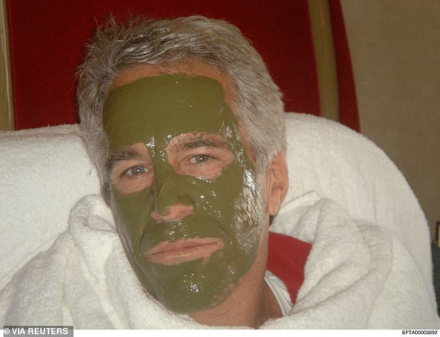 In this photo, that was likely from the same day given that Epstein is wearing the same white bathrobe, his face is covered in a green clay mask
