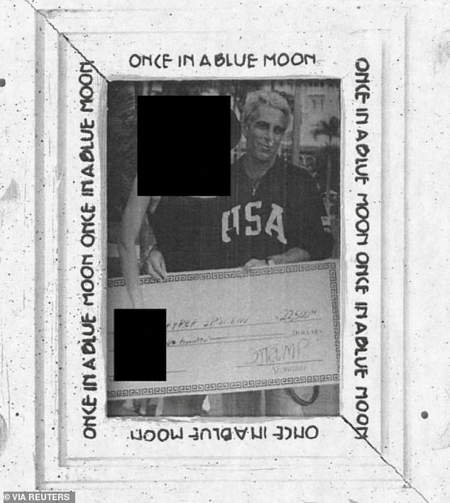 Justice Department Epstein files drop on December 19, 2025 reveal an image of Jeffrey Epstein with a redacted woman holding a giant check from Donald Trump for $22,500