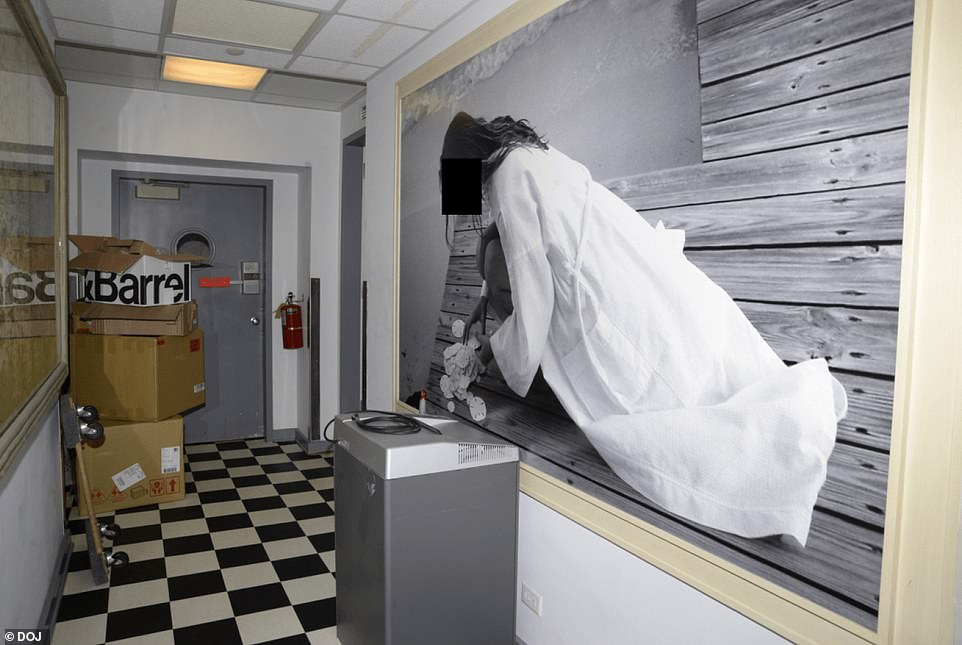 A tiled room of Epstein's home featured a massive photo of a woman in a robe