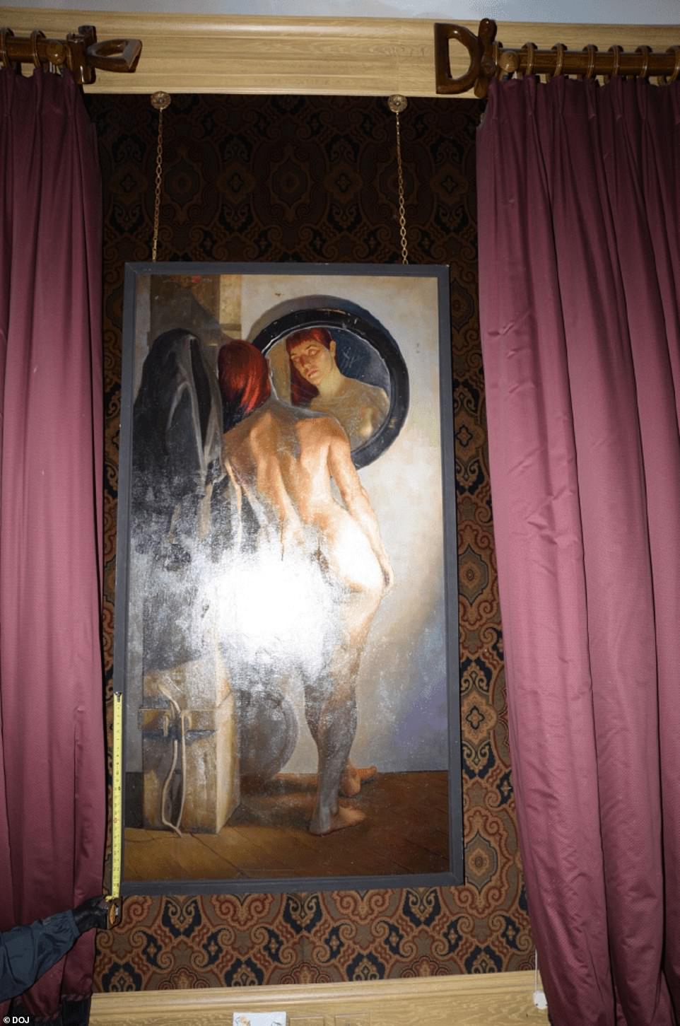 Pictured is a painting of a nude woman looking into a mirror