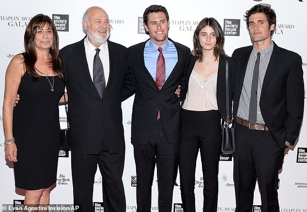 The Reiners, who married in 1989, had three children together - (from left) Jake, 34, Nick, 32, and Romy, 27; they are all pictured in 2014 at Avery Fisher Hall in New York