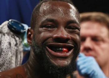 Why do boxers get Vaseline put on their face in between rounds in a fight?