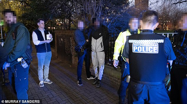 Guy Adams with plain clothed and uniformed officers as they arrest a phone thief