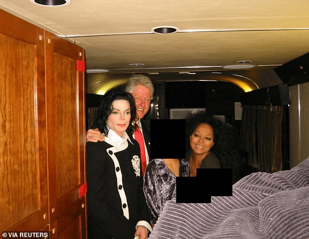 Clinton posed with Michael Jackson, Diana Ross, and a third redacted woman