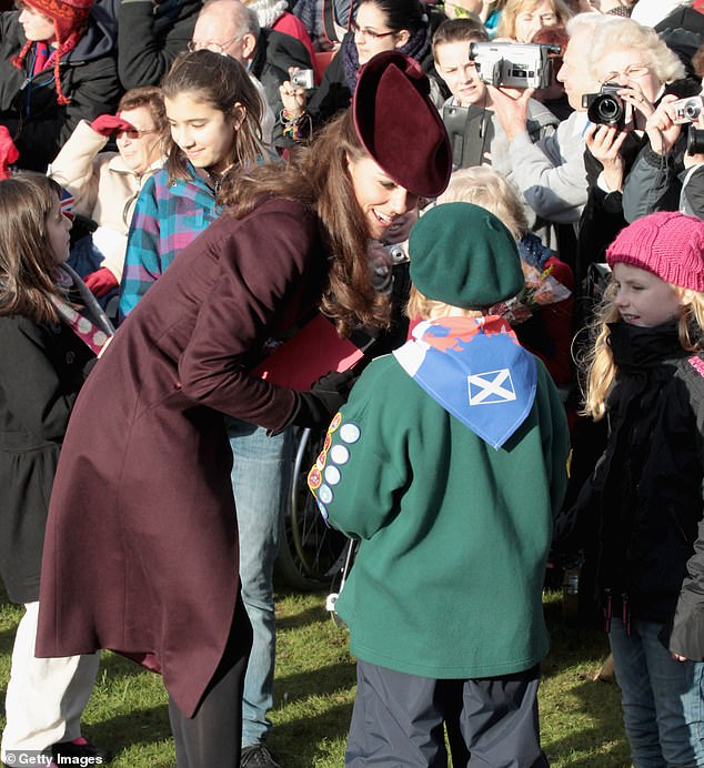 Outside, Kate and other members of the family gathered to wave to the cheerful crowds before making the short walk back to Sandringham to feast on a traditional Christmas dinne