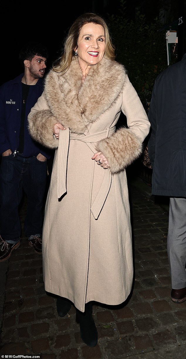 Susanna Reid, 55, was effortlessly chic in a light beige maxi-coat with trim fur details
