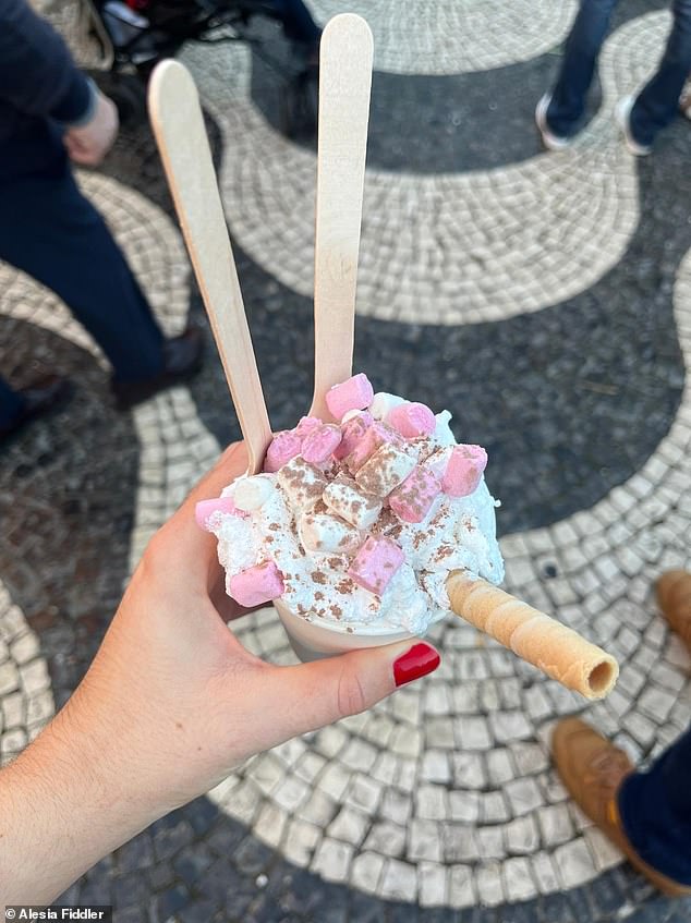 Ahot chocolate goes for ¿4.50 (£3.95), while a cup with all the trimmings cost (pictured) ¿6.50 (£5.70)