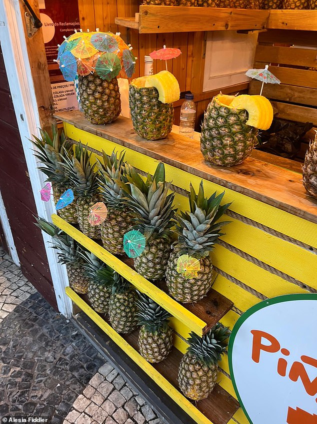 We walk past a stall selling pina coladas served in full pineapples for ¿15 (£13.18), with refills costing ¿5 (£4.40)