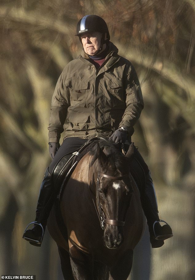 Andrew Mountbatten Windsor pictured looking glum today as he rides on the grounds of Windsor Castle
