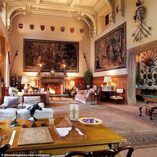 A wider shot of the room. This stunning, double-height room is where each member of the Royal Family comes together after dinner to watch the King's speech on Christmas Day