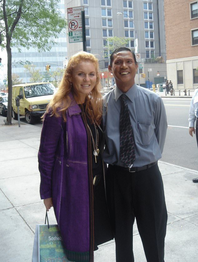 The former Duchess of York poses with people on the street, in an image released by the Department of Justice