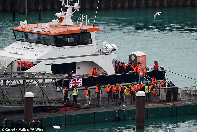 Pictured: Migrants arriving in Dover. Sources say tomorrow and Monday is also expected to be busy days for crossings, with thousands expected before Christmas