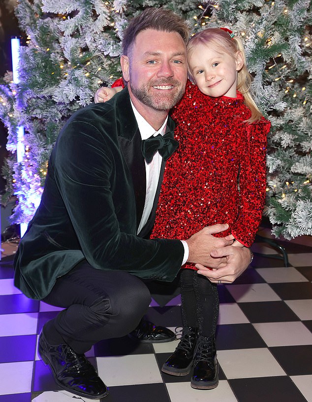 Brian and Ruby also posed for some daddy-daughter photos in front of the Mansion House's grand Christmas tree