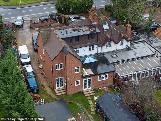 An overhead view of the back of Mr Hussain's Berkshire home. Works remain unfinished, with patching on part of the roof