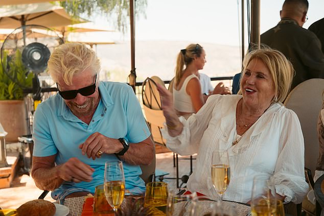 He wrote: 'I'm not sure what I was whispering into her ear when these photos were taken on her 80th birthday this year, but I'm glad it made her smile!'
