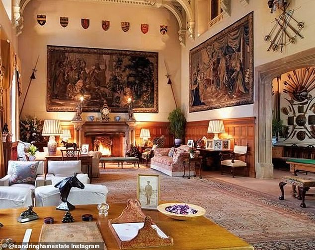 A wider shot of the room. This stunning, double-height room is where each member of the Royal Family comes together after dinner to watch the King's speech on Christmas Day
