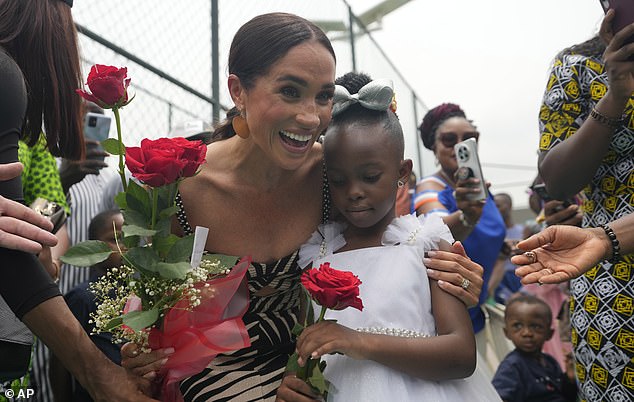 Three members of staff at the Archewell Foundation have been let go as it 'restructures' under a new name. Pictured: Meghan at a volleyball match in Abuja, Nigeria, in 2024