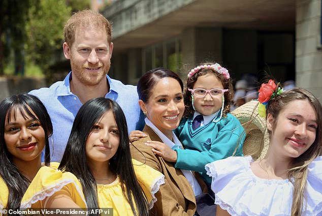 The Duke and Duchess of Sussex with students of the La Giralda School in Bogota in 2024