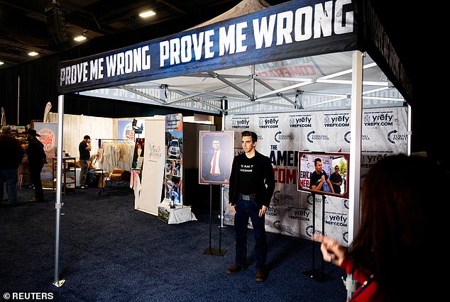 The tent and photo setup is at AmFest, the annual youth conference for the organization Kirk founded, Turning Point USA