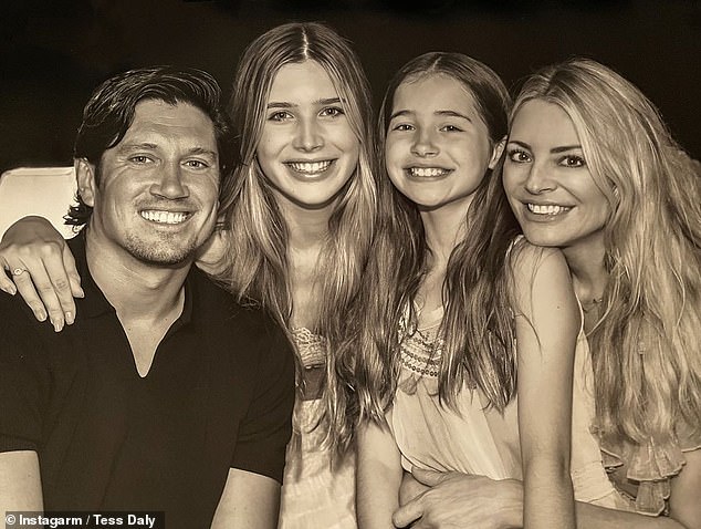 Earlier in the day ahead of the live show, Tess shared a clip on her Instagram stories writing: 'Woke up to a lovely surprise from my girls on finals day!' (pictured with daughters Phoebe and Amber and husband Vernon Kay)