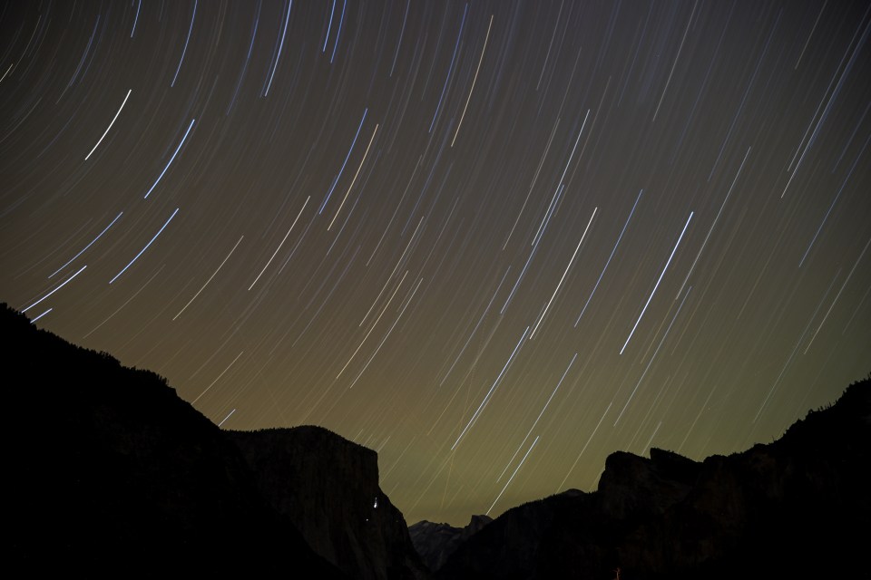 The Geminids meteor shower streaking across the night sky above Yosemite National Park.