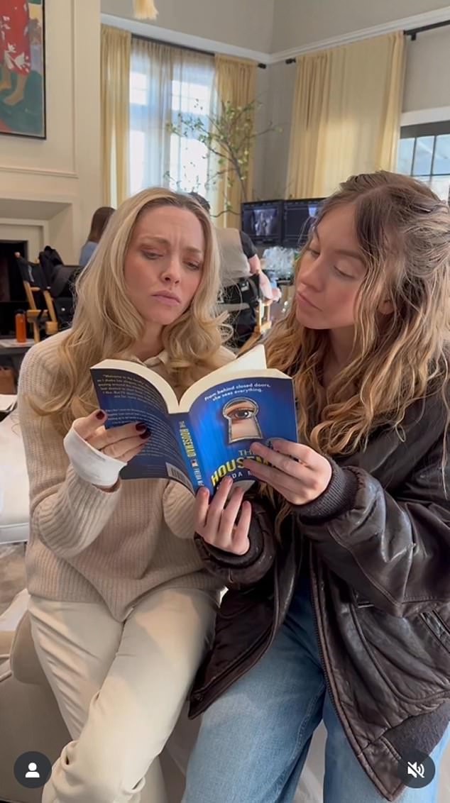 Sweeney and co-star Amanda Seyfried pictured with the 2022 novel the movie is based on