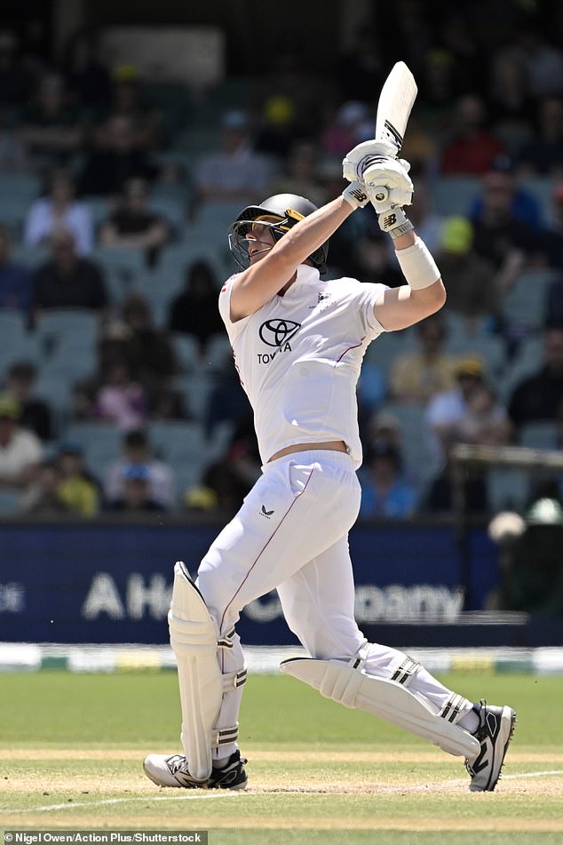 Pictured: Jamie Smith tries to hit his fifth boundary in a row - but skies the ball to be caught out by Cummins in one of the turning points of the final day's play