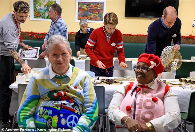 The father and son were seen setting up long tables for service users at The Passage