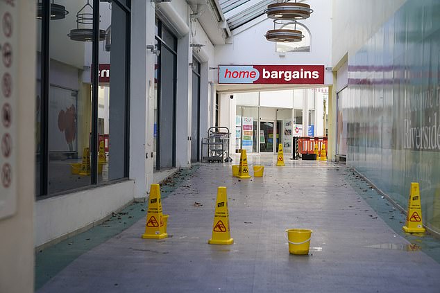 Pictured: The empty corridors in the mall leading to the only open shop - Home Bargains