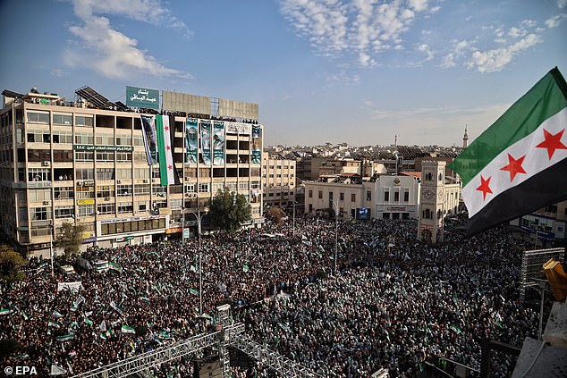 A general view shows hundreds of people gathered in Al-Assi Square during celebrations marking one year since the city's liberation, in Hama, Syria, December 5 2025