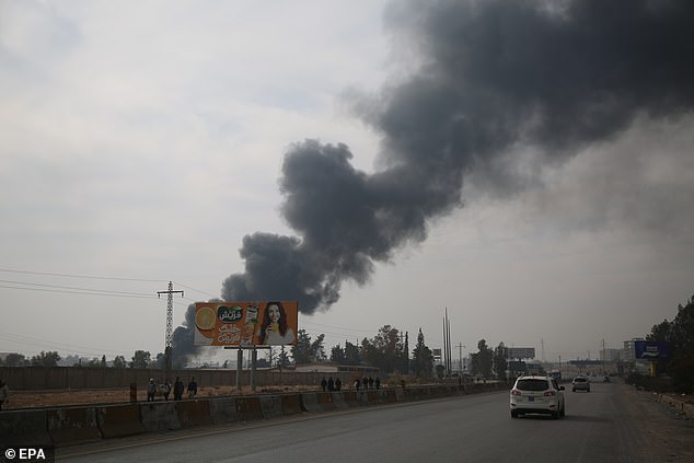 Smoke rises after Syrian rebels took over Damascus, Syria, December 8 2024