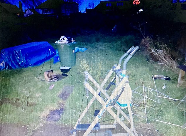 The garden was strewn with rubbish left behind by the previous tenants. Under the blue tarpaulin lay several old mattresses
