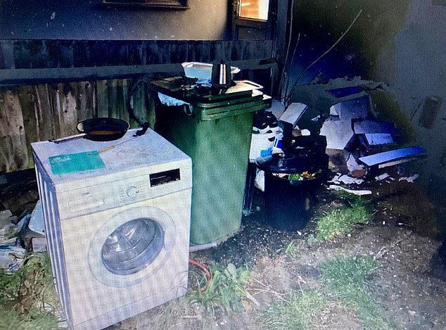 Discarded household items were left at the side of the house. Despite the condition of the residence, Lisa Freedman said she could see its 'potential' - but did not realise it was a brothel
