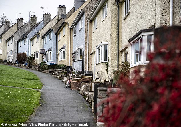 Locals told of how it is the 'most beautiful council estate' with its painted houses and scenic backdrop