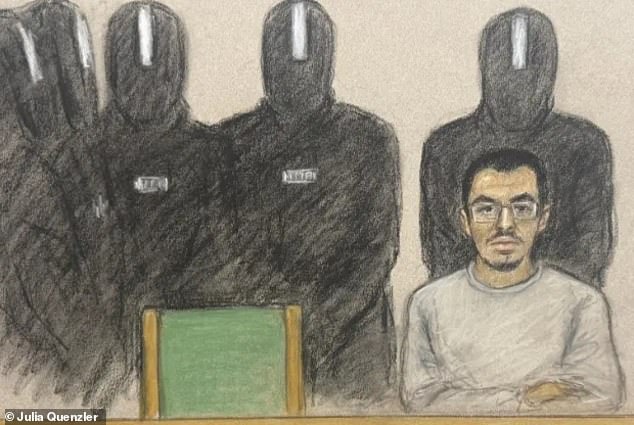 Manchester Arena plotter Hashem Abedi stands accused of attacking three prison officers. He is seen on a prison video link surrounded by five officers in protective gear