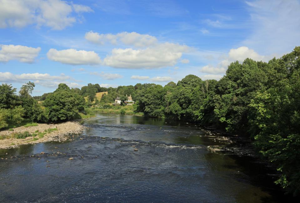 River Ribble in Hurst Green, Lancashire, with a house visible on the riverbank.
