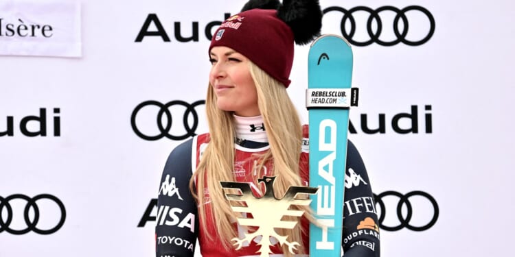 Skiing legend Lindsey Vonn pipped to World Cup glory... as champion gifted a BABY COW and a massive wheel of cheese