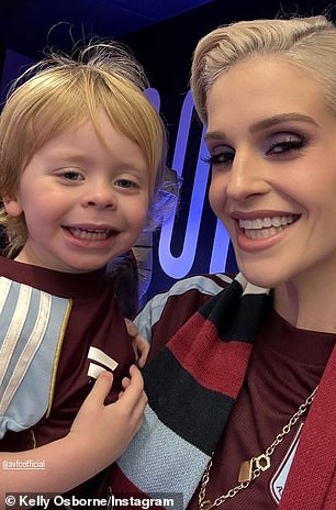 She could not wipe the smile off her face as she cuddled her son close