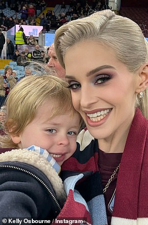 She could not wipe the smile off her face as she cuddled her son close