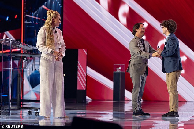 Erika looks on as a student from Utah Valley University is given an award during AmericaFest, the first Turning Point USA summit since the assassination of Charlie Kirk