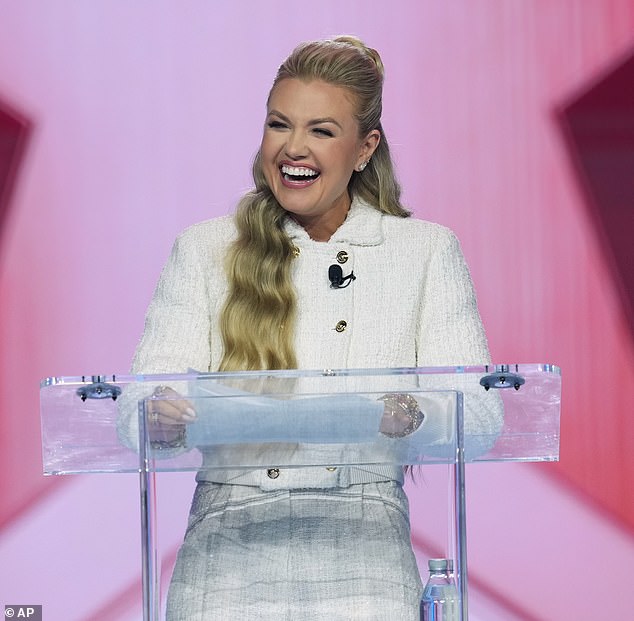 Erika Kirk smiles during Student Awards at Turning Point USA's AmericaFest 2025 on Saturday